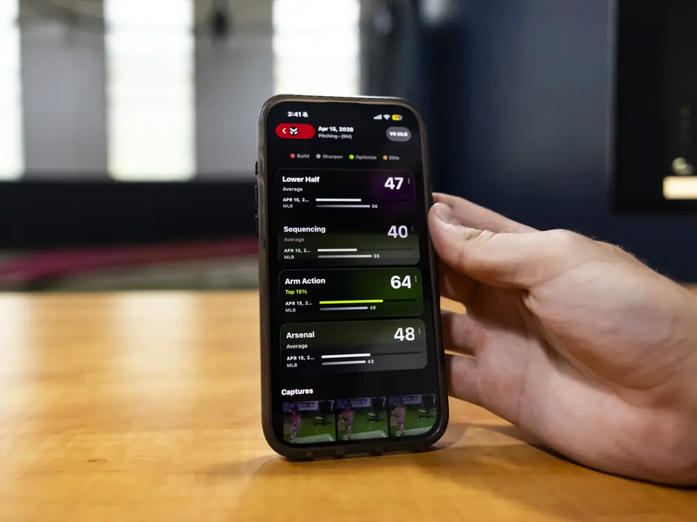 A phone showing the Maven App with an athlete's scores